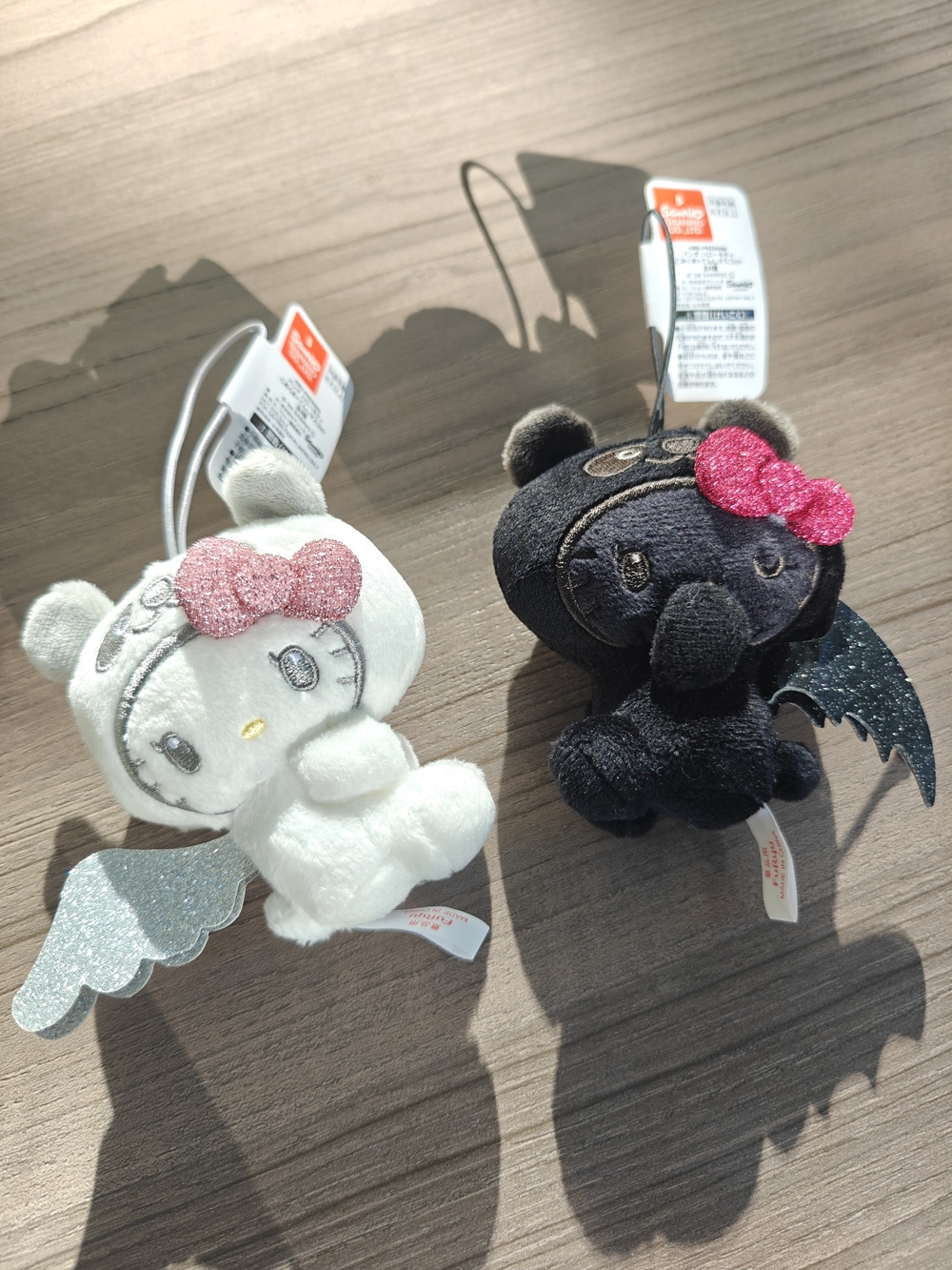 Sanrio Hello Kitty Winged Plush Keychain Set - White and Black with Pink Bows